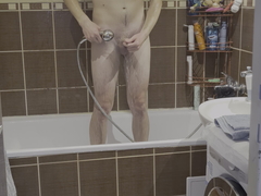 Amateur youthful man showering himself ...
