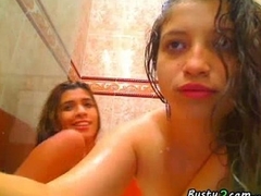 Two busty latinas playing on be imparted to murder shower